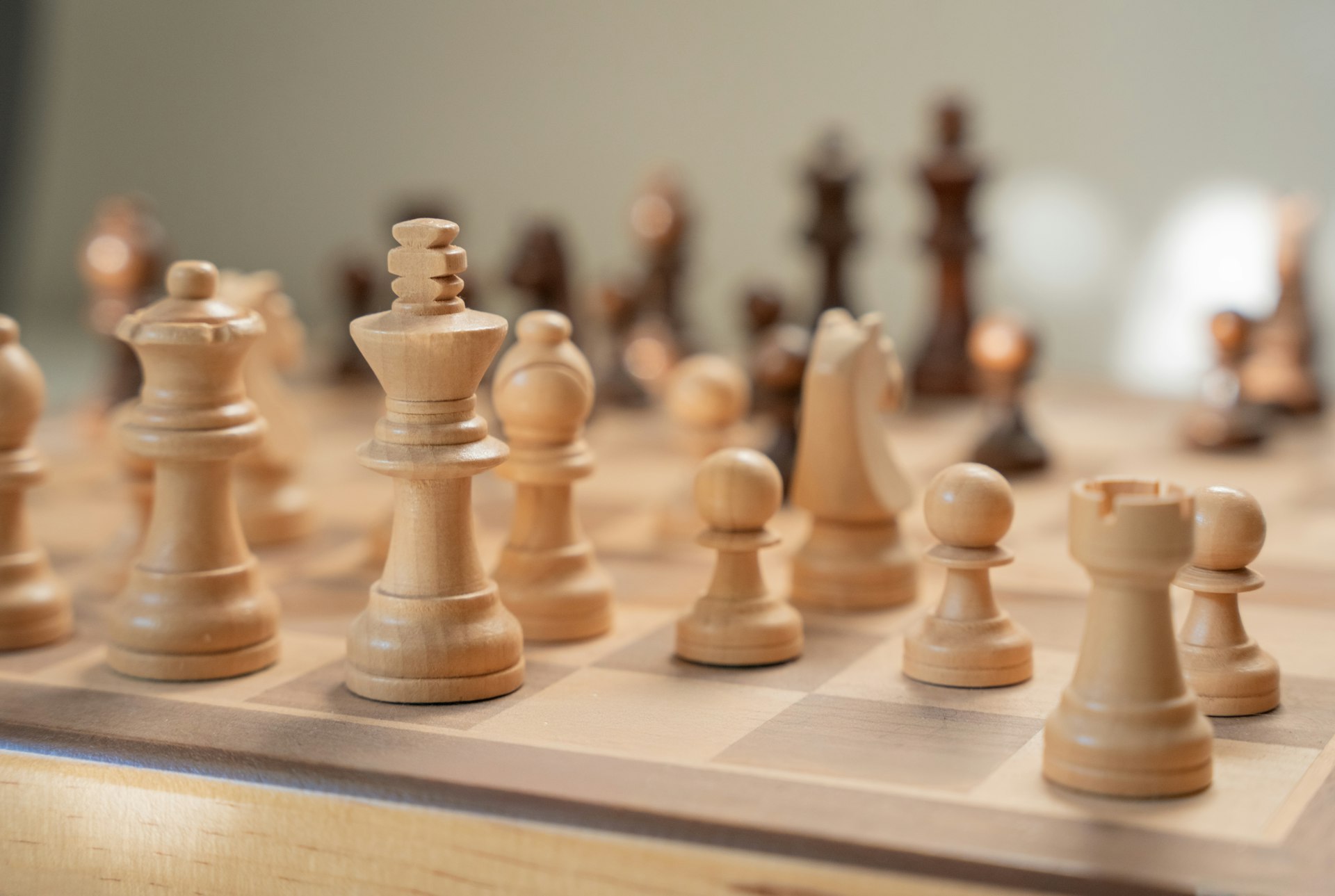 A close up of a chess board with pieces on it